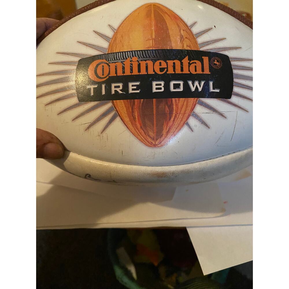 Continental Tire Bowl football signed by the coach Tar Heels John Bunting